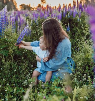 Psychiatric consultation service can help you enjoy the moments like this mother with her child in a heather field.